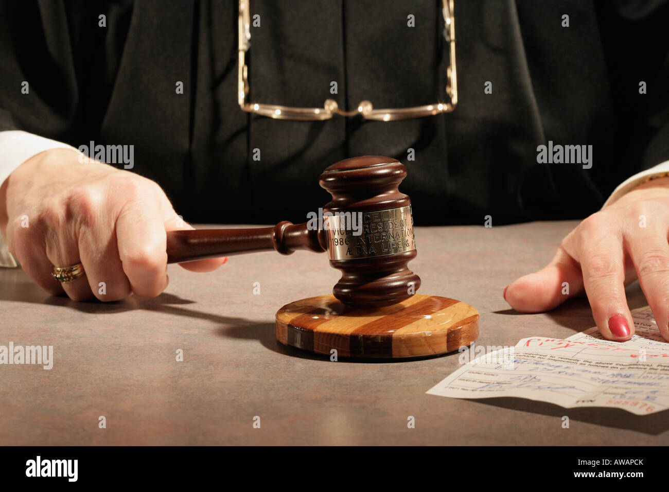 Judge using a gavel Stock Photo Alamy
