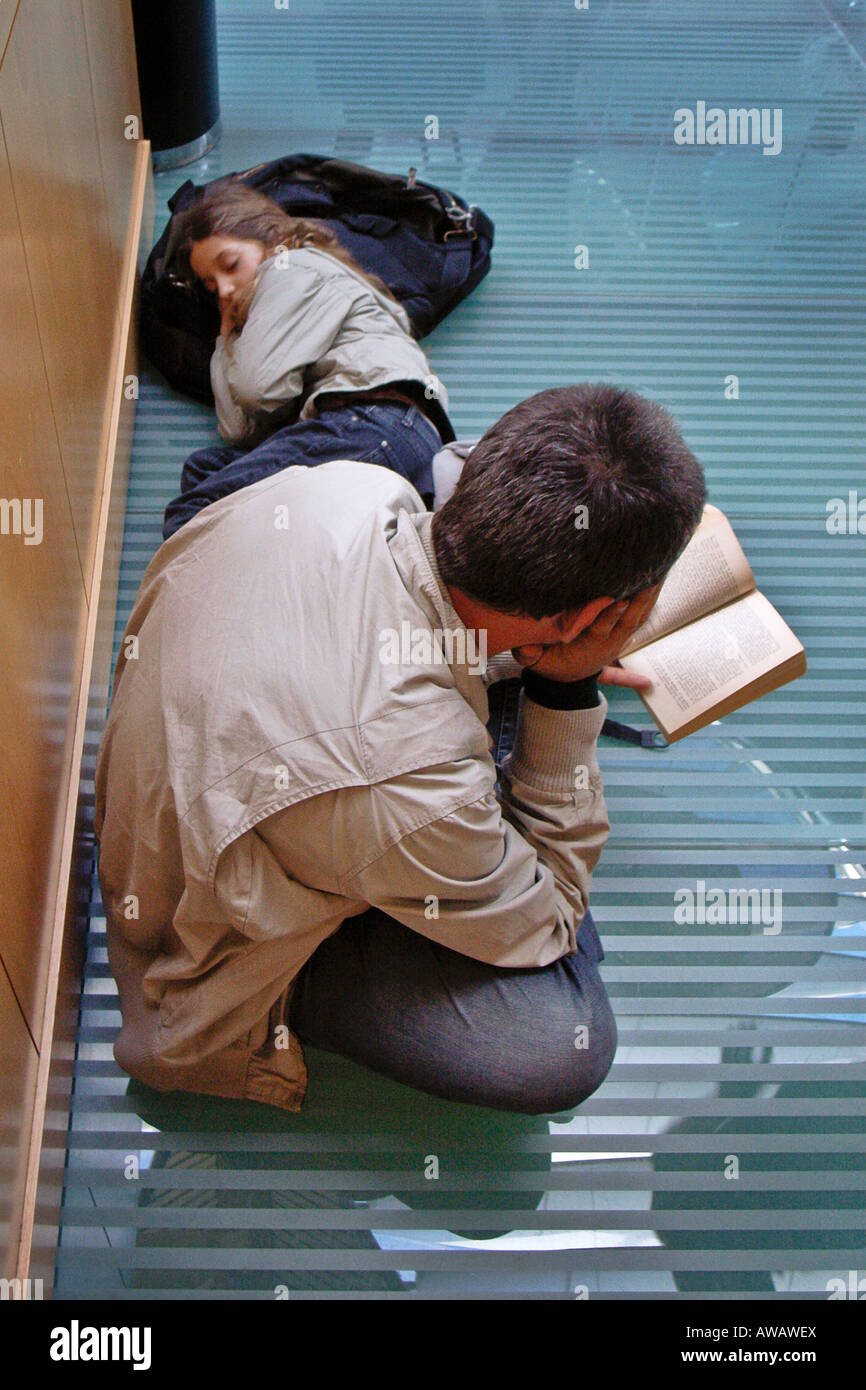 Waiting couple at airport, Madrid, Spain Stock Photo