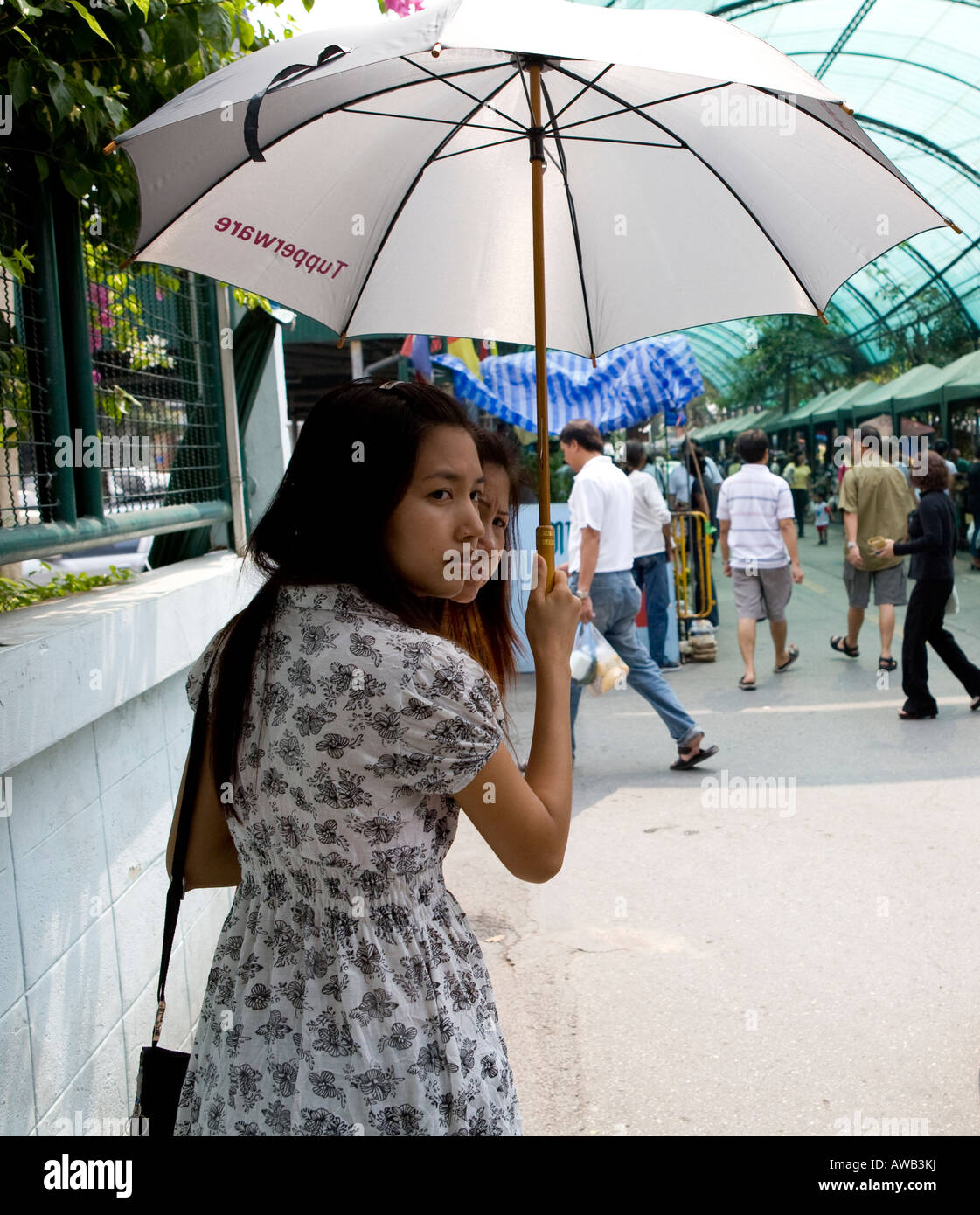 Local Thai Woman With Umbrella In A Bangkok Market Thailand South East Asia Stock Photo