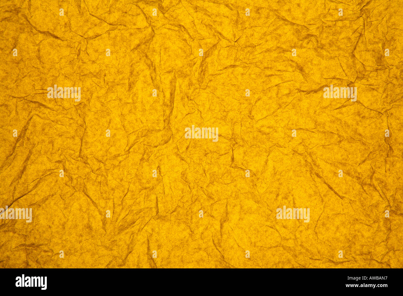 ABSTRACT RANDOM BACKGROUND OF CREASED CRUMPLED ORANGE TISSUE PAPER Stock Photo
