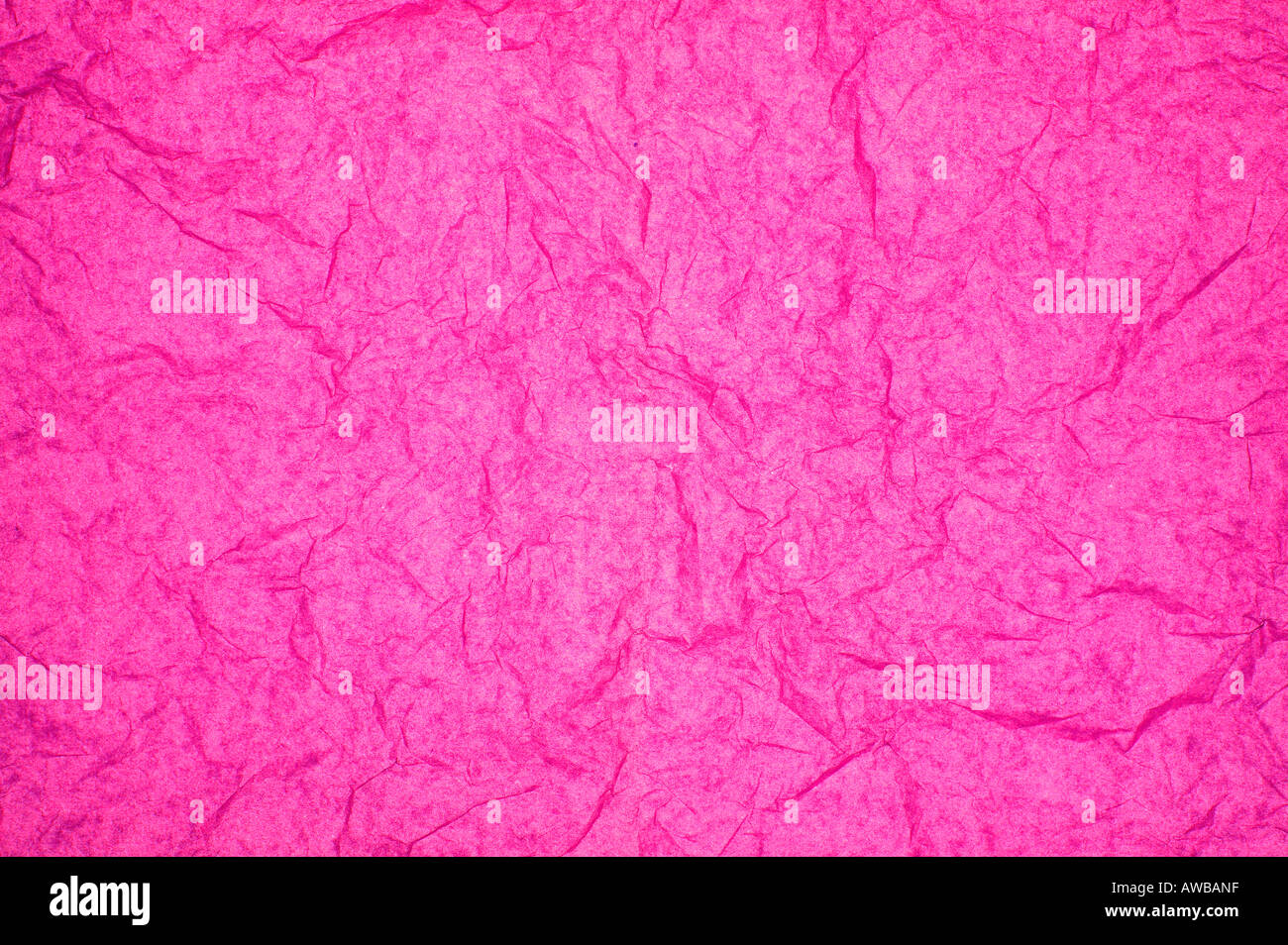 ABSTRACT RANDOM BACKGROUND OF CREASED CRUMPLED BRIGHT PINK TISSUE PAPER Stock Photo