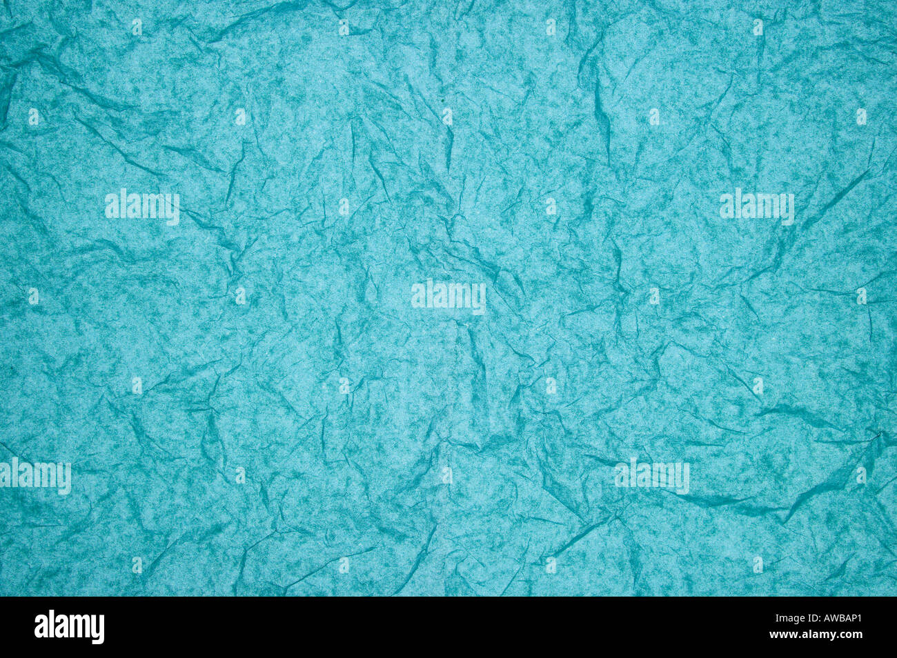 ABSTRACT RANDOM BACKGROUND OF CREASED CRUMPLED TURQUOISE BLUE TISSUE PAPER Stock Photo