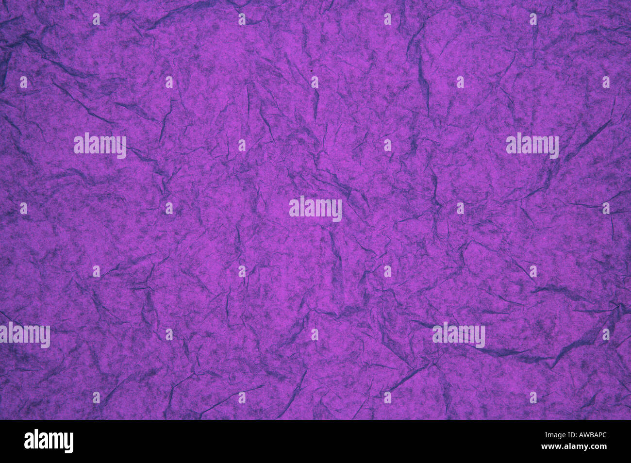 ABSTRACT RANDOM BACKGROUND OF CREASED CRUMPLED PURPLE TISSUE PAPER Stock Photo