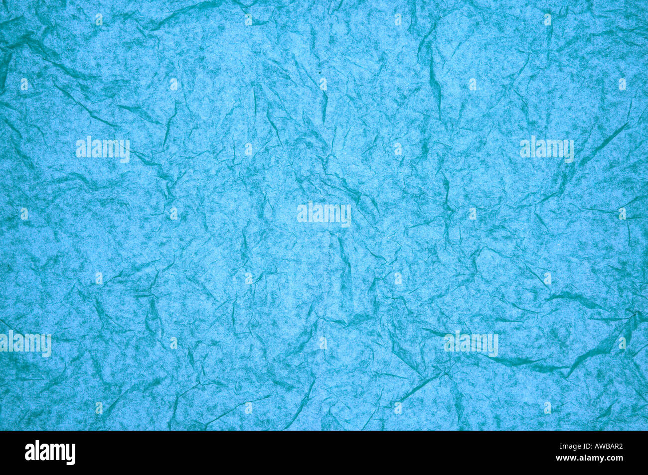 Crumpled colorful tissue paper on a blue tissue paper background Stock  Photo - Alamy