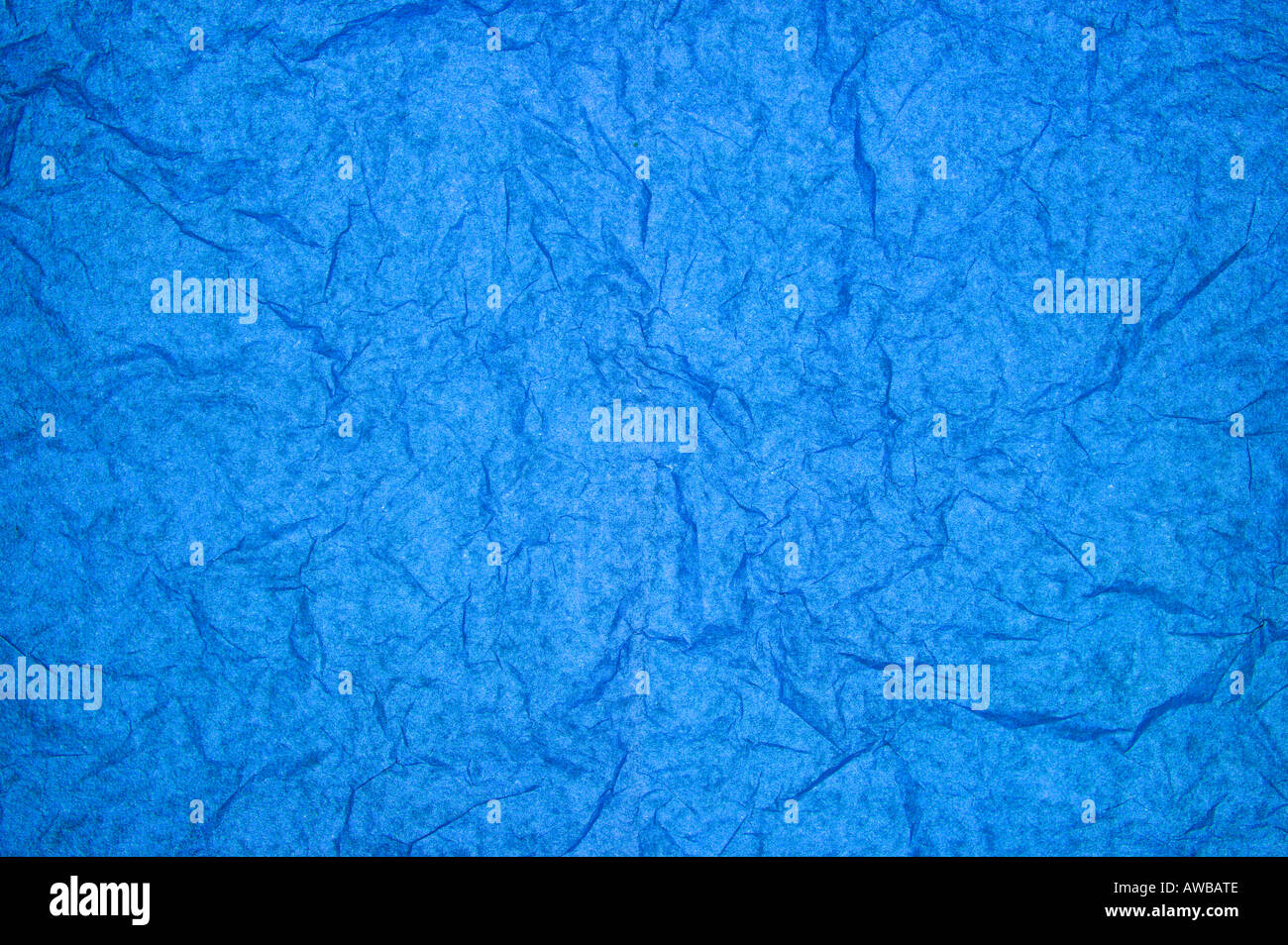 ABSTRACT RANDOM BACKGROUND OF CREASED CRUMPLED BRIGHT BLUE TISSUE PAPER Stock Photo