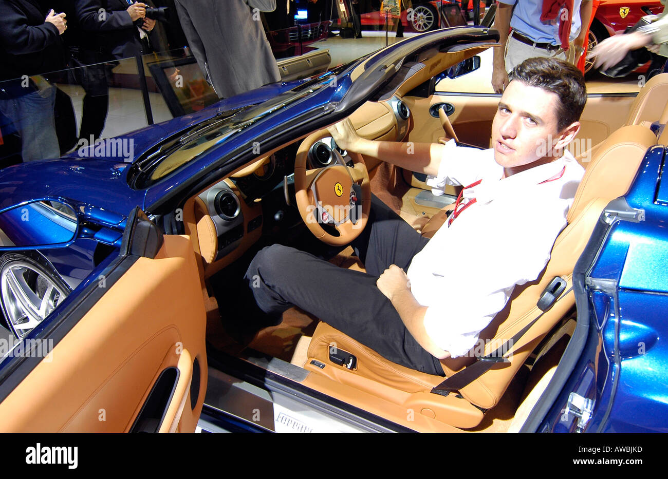 A journalist inside a luxury Ferrari car during the International Motor Show in Paris, France Stock Photo