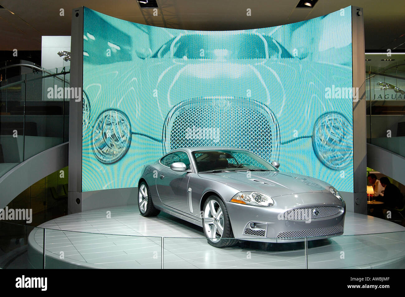 International Auto Show, with an advertising movie appearing on the giant screen  behind. Stock Photo