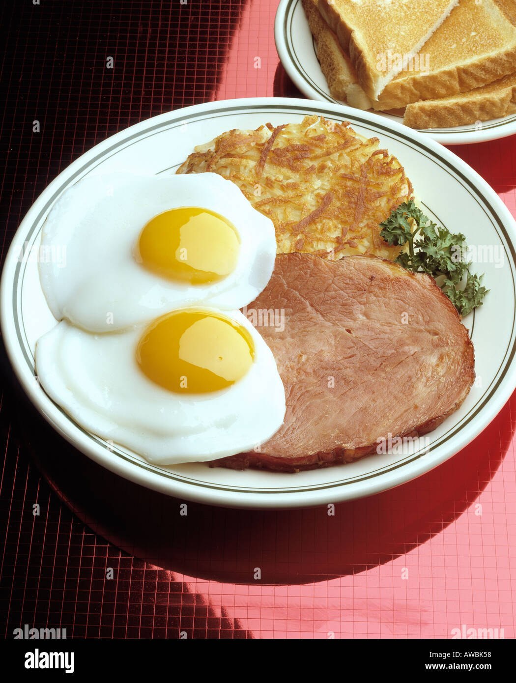 breakfast two fried eggs sunny side up slice ham hash brown potato