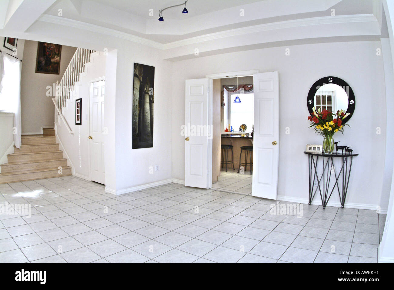 View of a spacious room leading into a kitchen Stock Photo