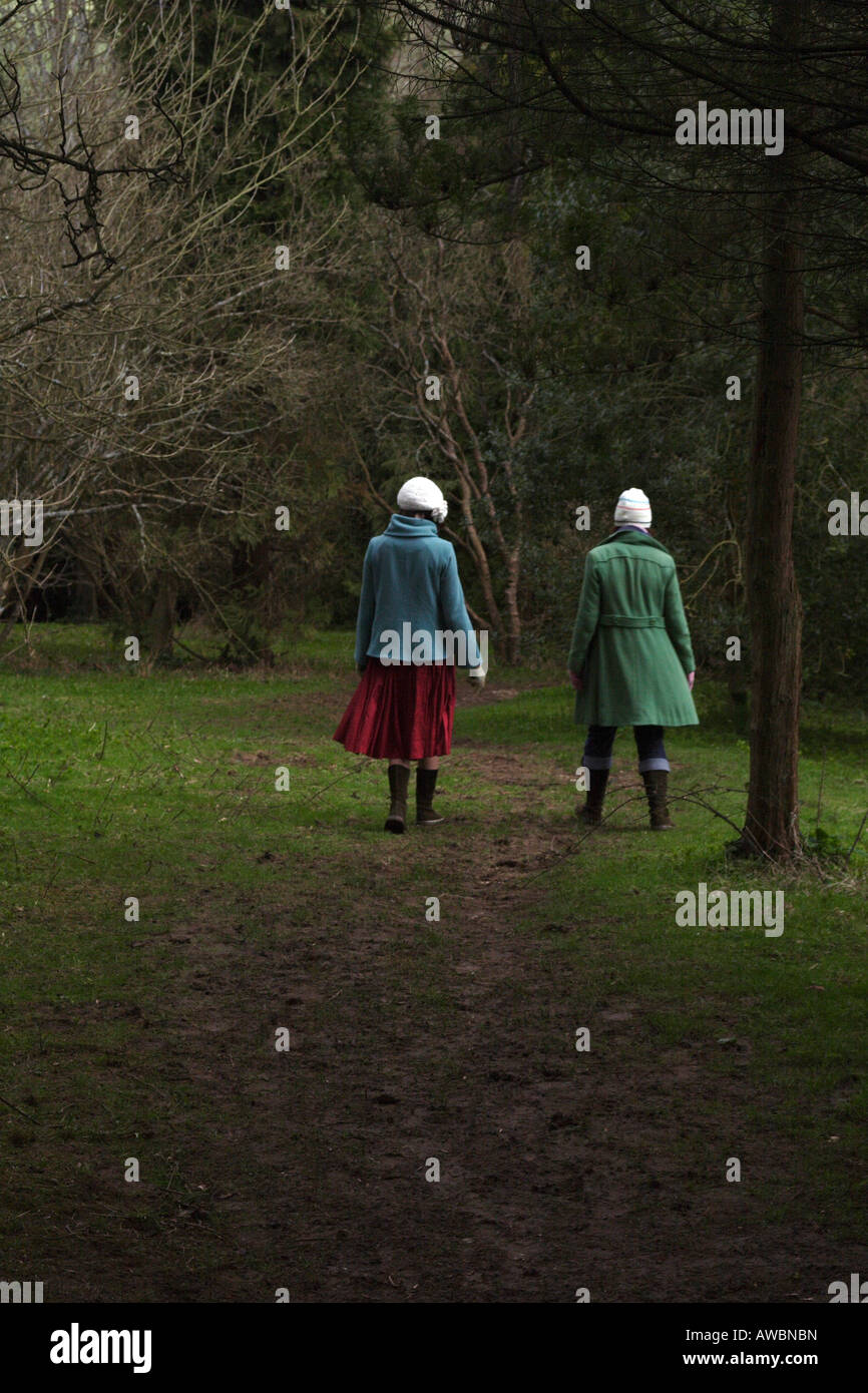 two women walking in the forest Stock Photo - Alamy