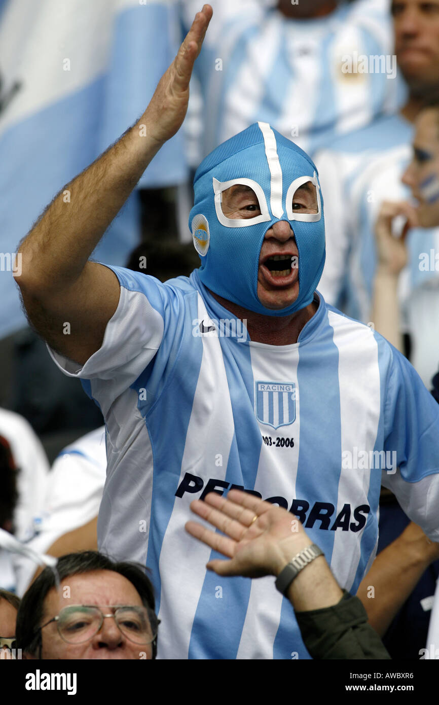 A male Argentinian football fan wearing a mask sings in the crowd during  the 2006 World Cup Stock Photo - Alamy