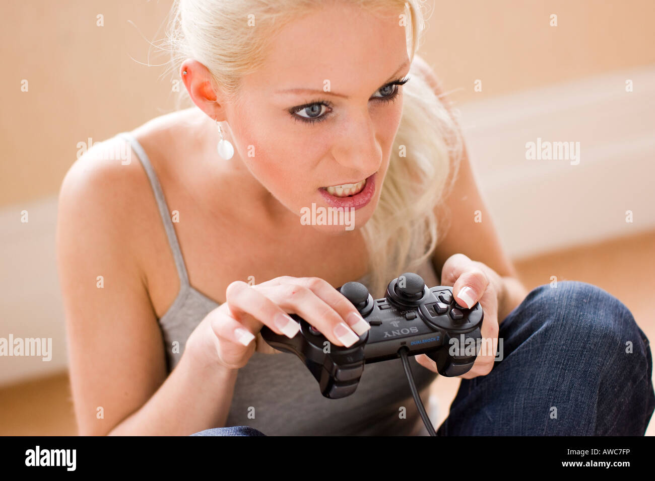 Girl playing on Playstation game Stock Photo