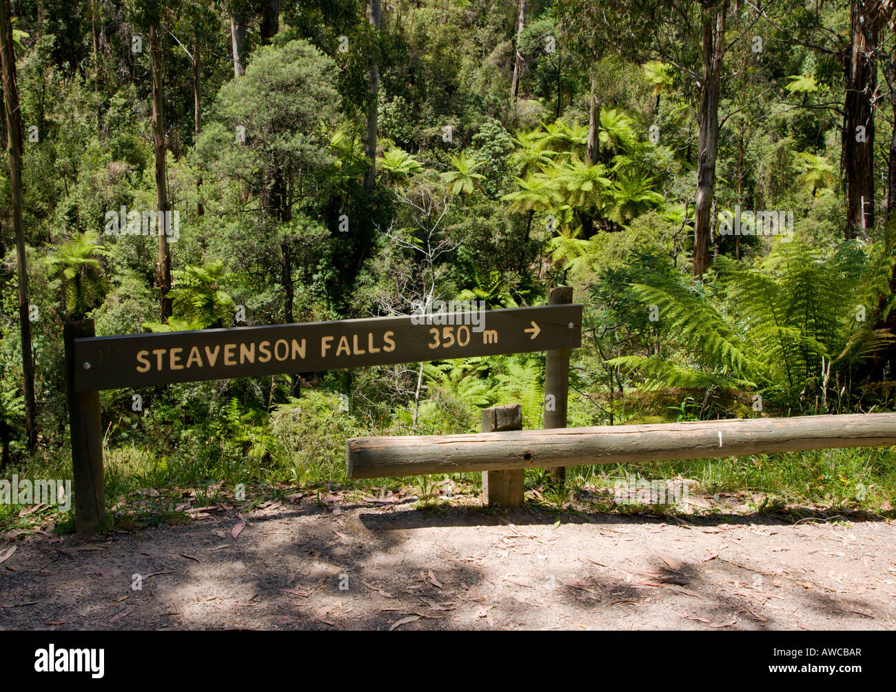 A sign pointing and advising the distance to steavenson falls in Victoria Australia. Stock Photo
