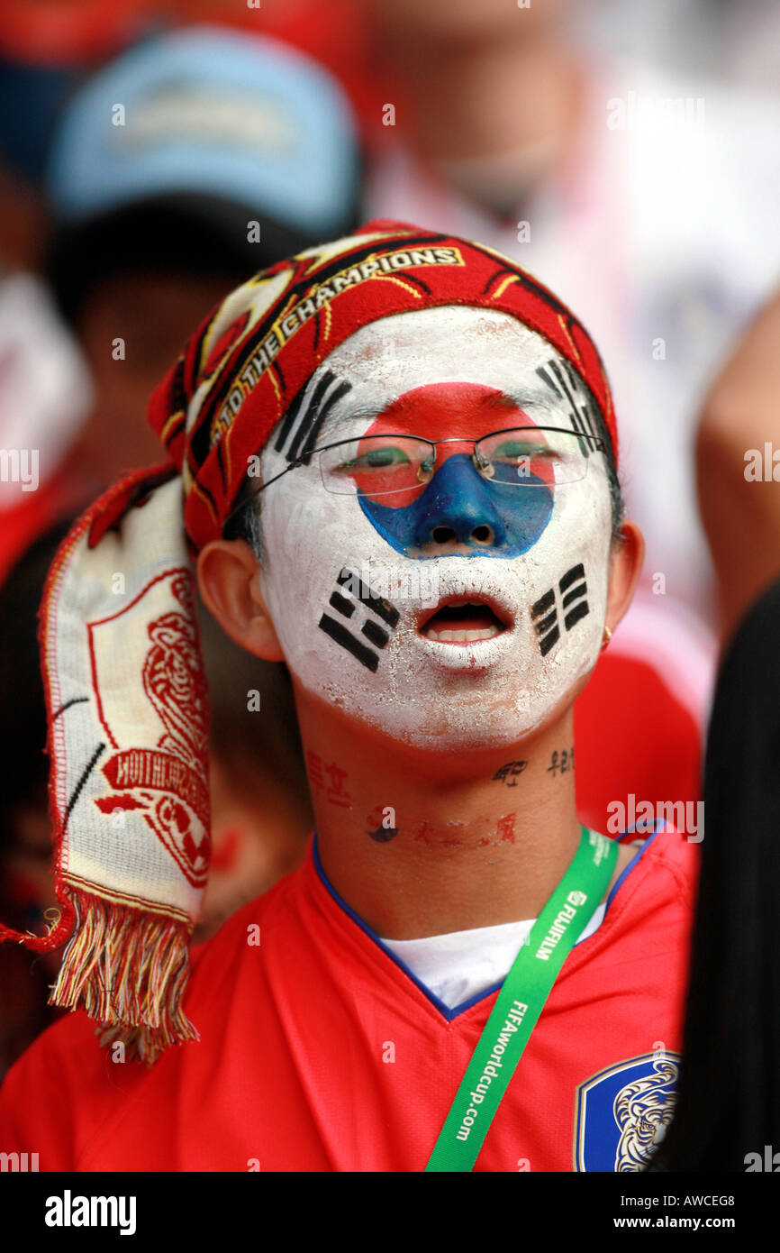 Soccer football in the supporters crowd face in the crowd hi res stock