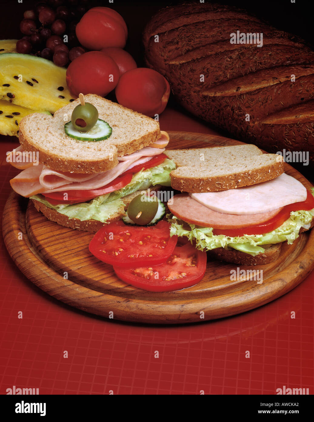 sliced bologna turkey tomato lettuce olive sandwich sandwiches bread