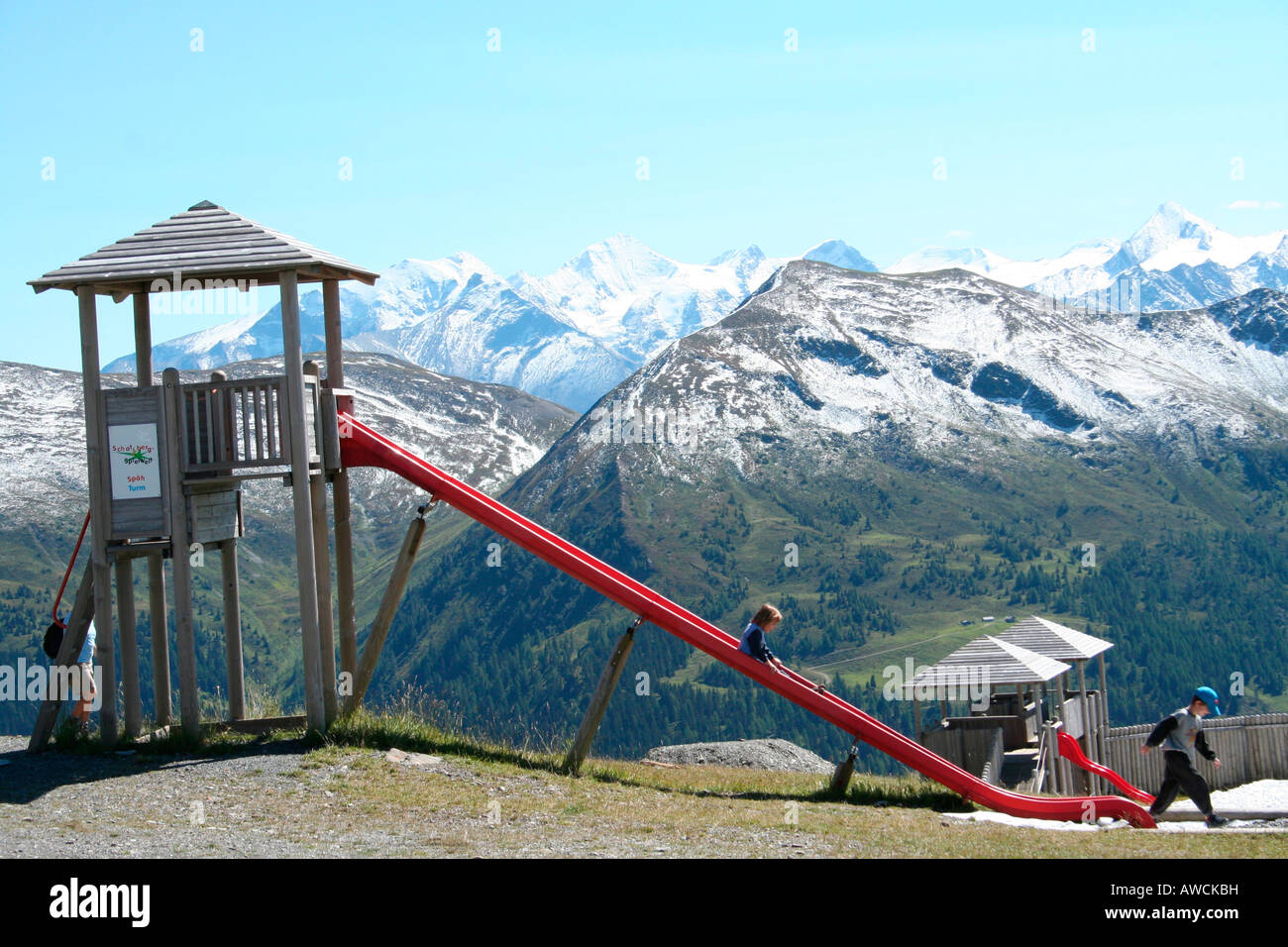 Vacation with children, playground in front of an Alpine panorama, Austria, Europe Stock Photo