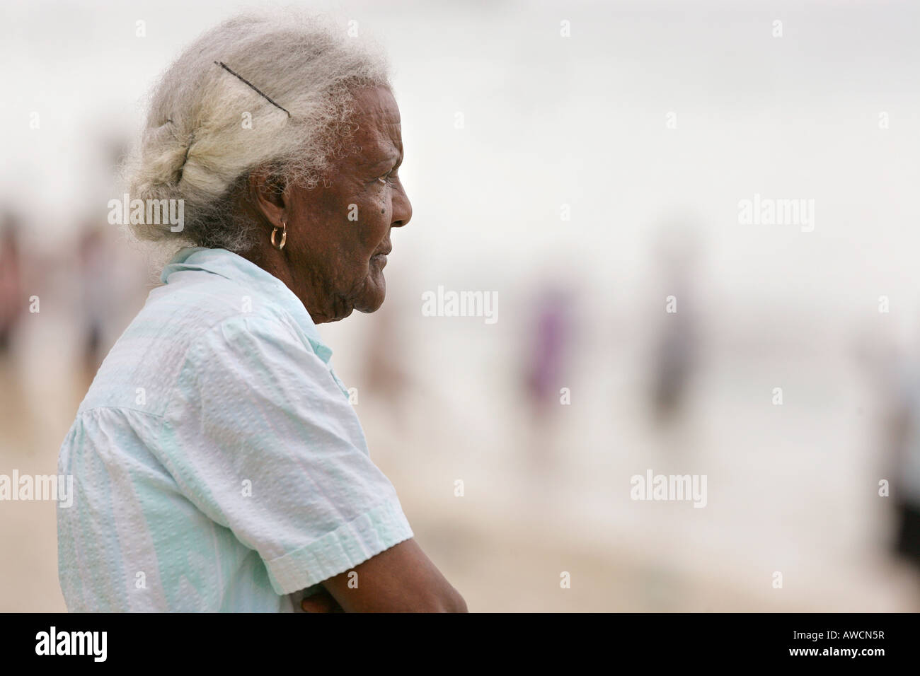 Elderly Woman, Public Beach, Mauritius Stock Photo