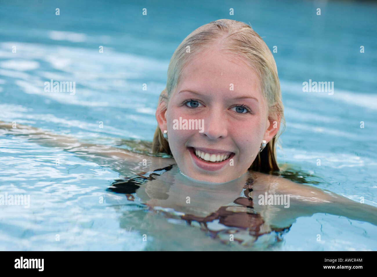 Portrait of laughing blond woman in the water Stock Photo - Alamy