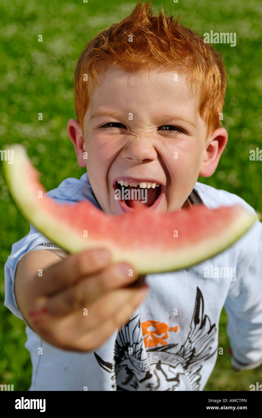 Boy eats a water melon Stock Photo Alamy