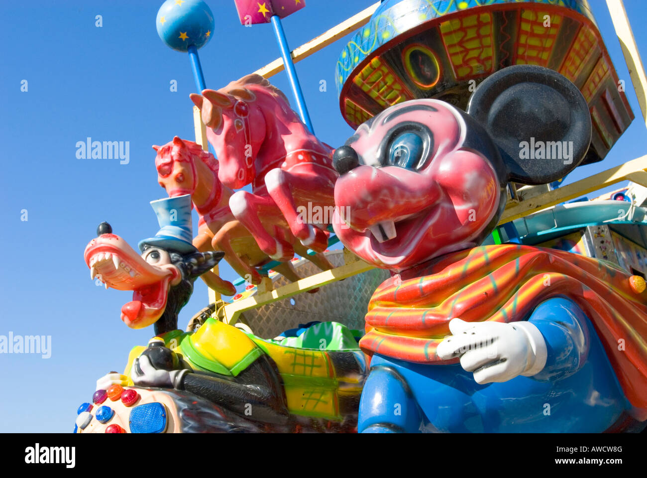 Spain Canary Islands Tenerife Mickey Mouse and Goofy colourful funfair figures smiling loughing screaming yelling fun Stock Photo