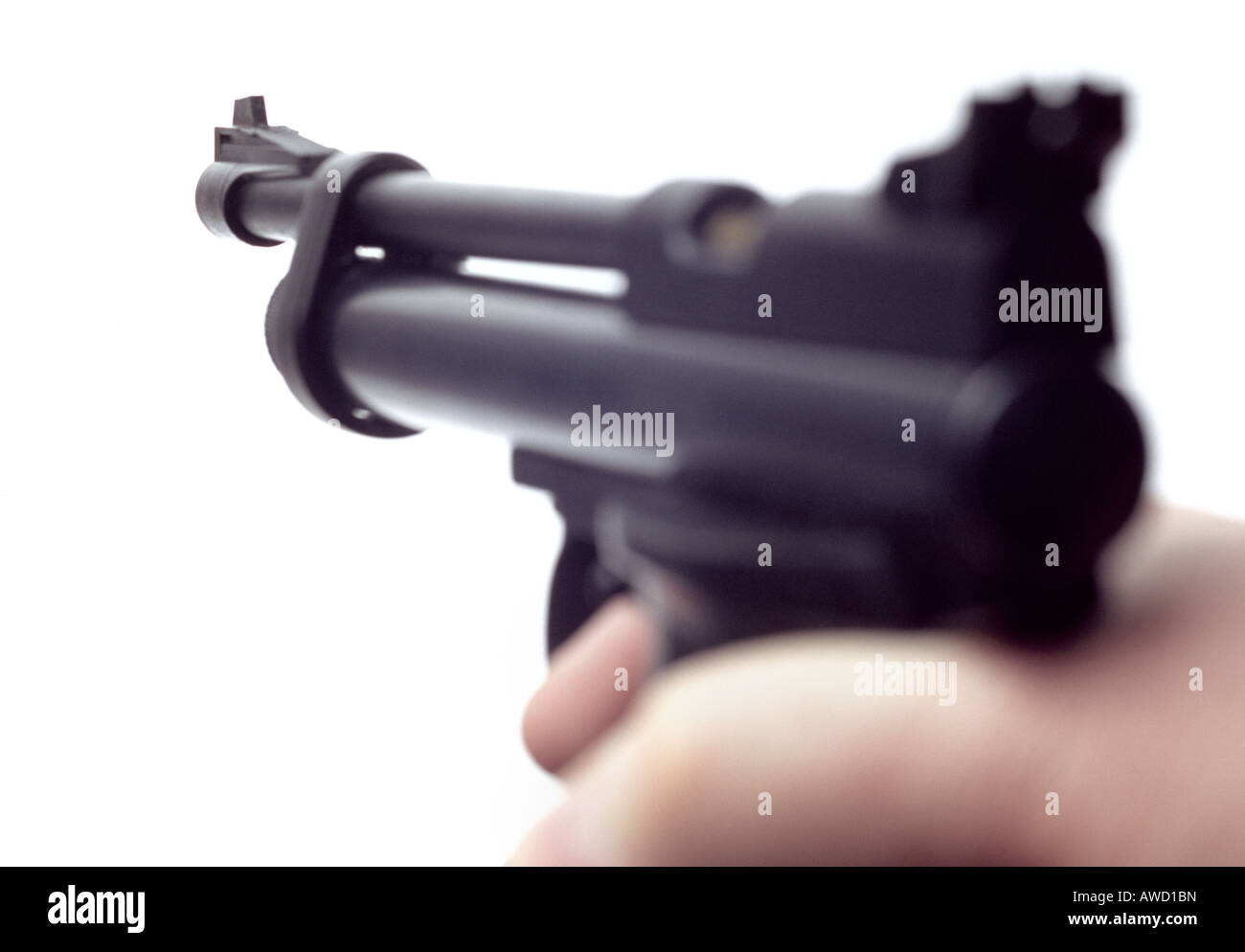 Person holding a black handgun. Stock Photo