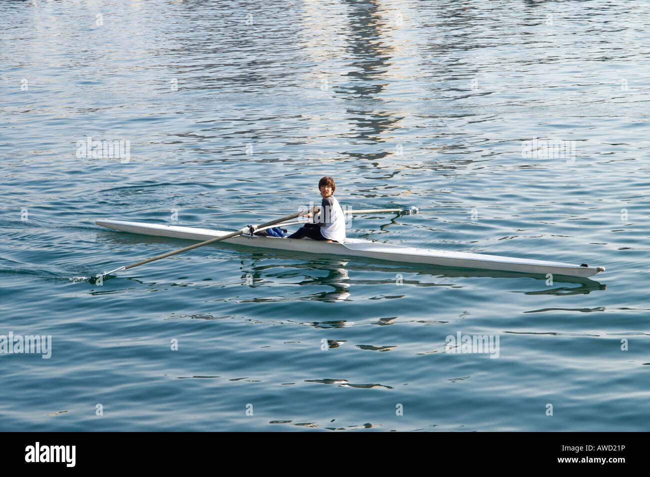 Single rowing skiff at Barcelona harbour Stock Photo
