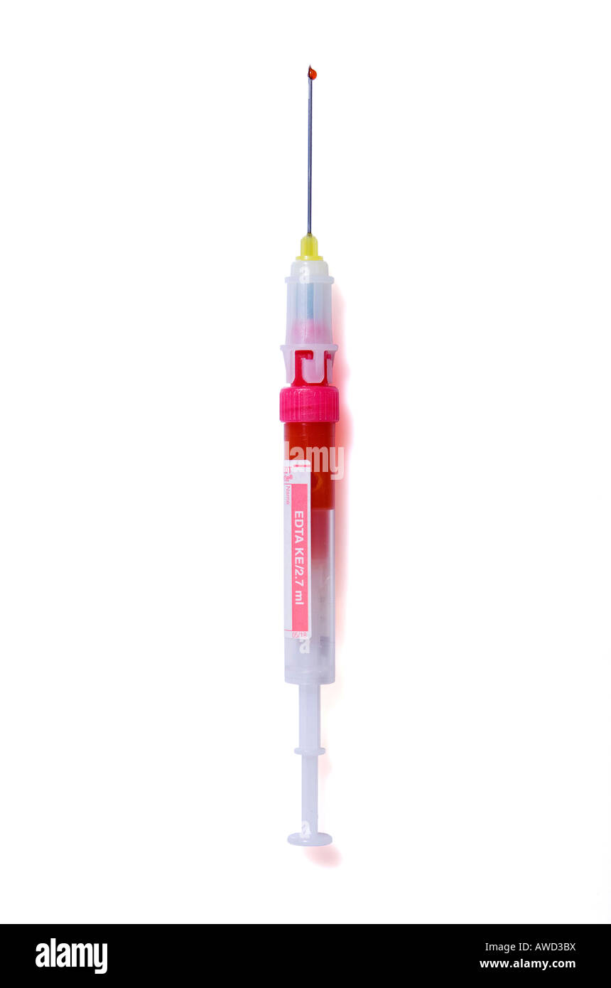 Wound-up disposable syringe with a drop of blood on the top of the needle Stock Photo