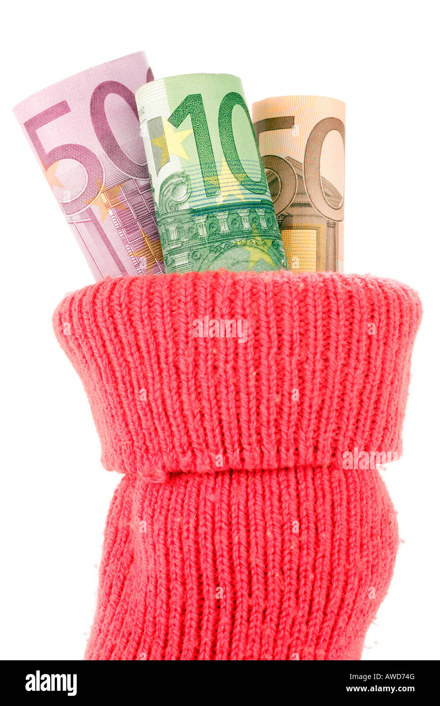 Saving money - Euro bank notes put into a red sock deposit Stock Photo