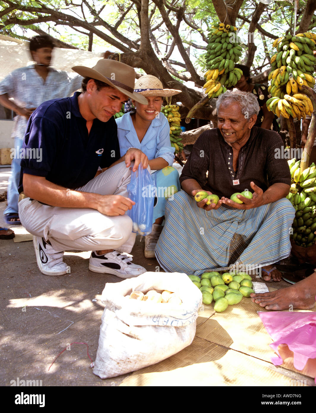 Young couple shopping, market vendors, Male (Dhivehi), Maldives, Indian Ocean Stock Photo