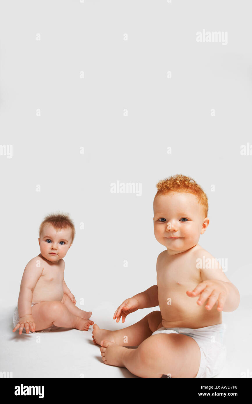 Two babies looking at camera Stock Photo