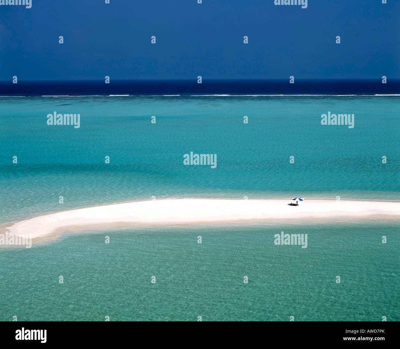 Aerial view of lone sun umbrella on a sand bank, lagoon, turquoise waters, Maldives, Indian Ocean Stock Photo
