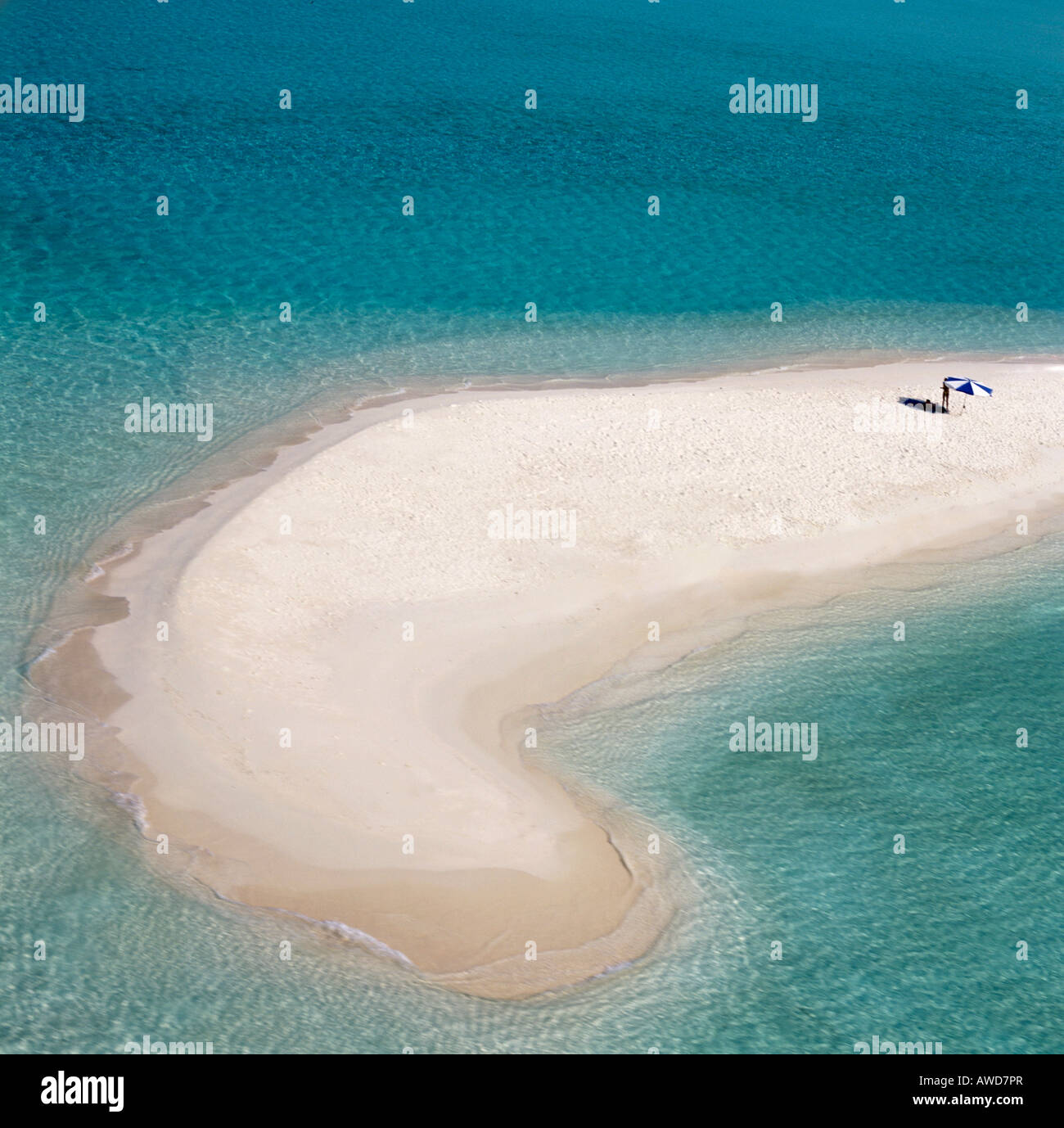 Aerial view of lone sun umbrella on a sand bank, lagoon, turquoise waters, Maldives, Indian Ocean Stock Photo