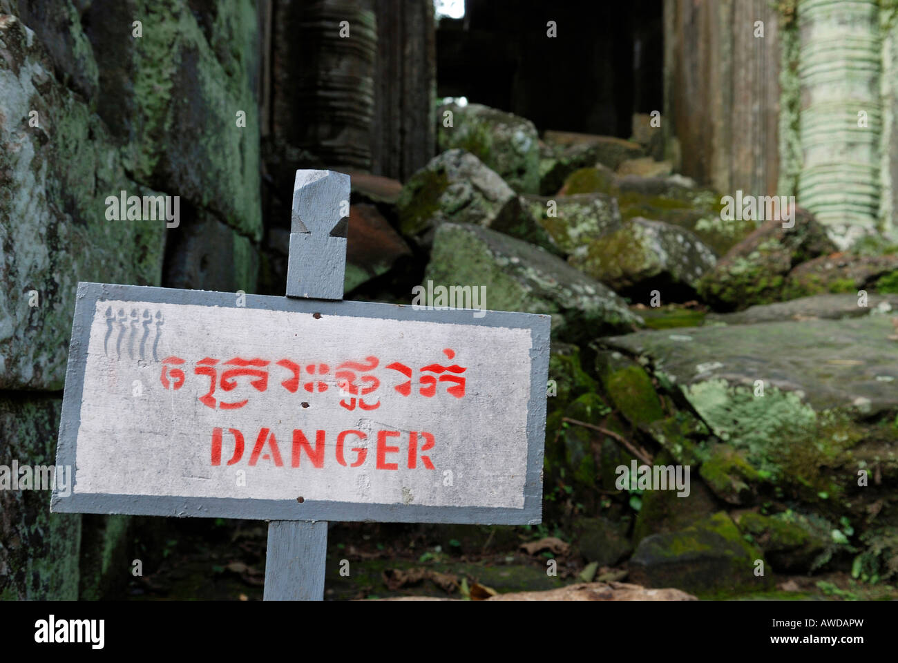 Sign 'Danger' warns of climbing in the ruins of Preah Paliliay tempel in the ancient city Angkor Thom, Cambodia Stock Photo