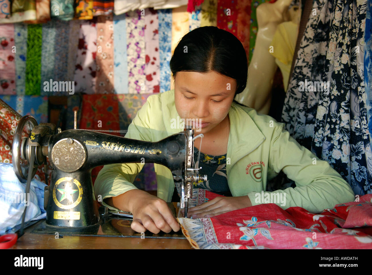 Female tailor, borderline with Thailand near Maesot, Burma Stock Photo