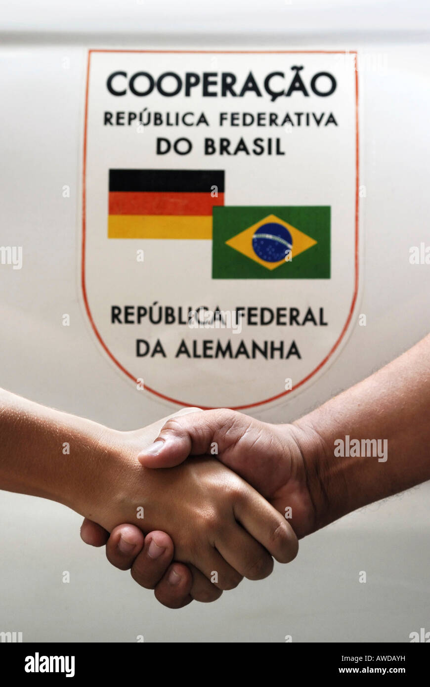 Sign for german-brazilian cooperation and two hands shaking Stock Photo