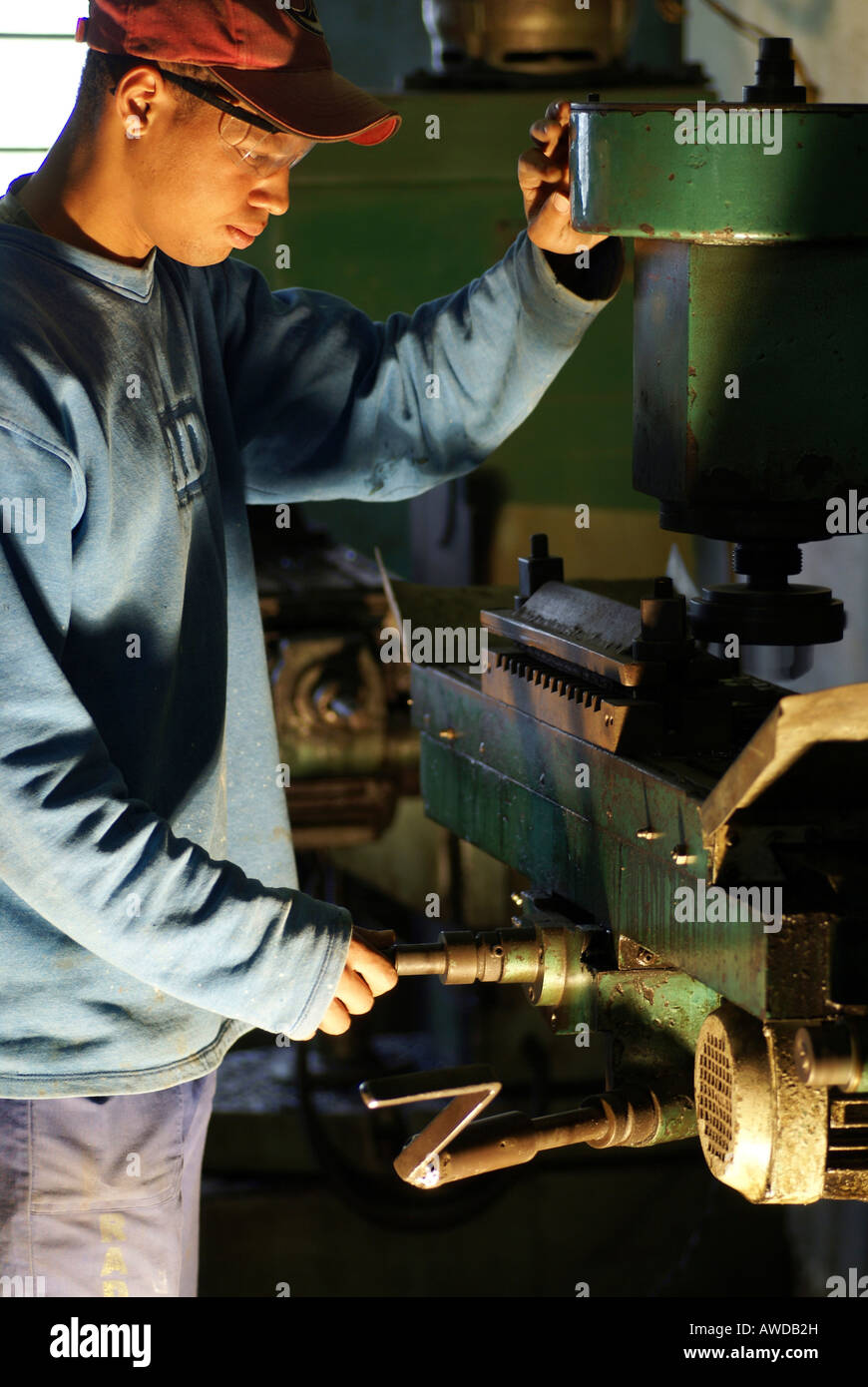 Adolescent Trainee at a milling Machine in the metal industry, Petropolis, Rio de Janeiro, Brazil Stock Photo