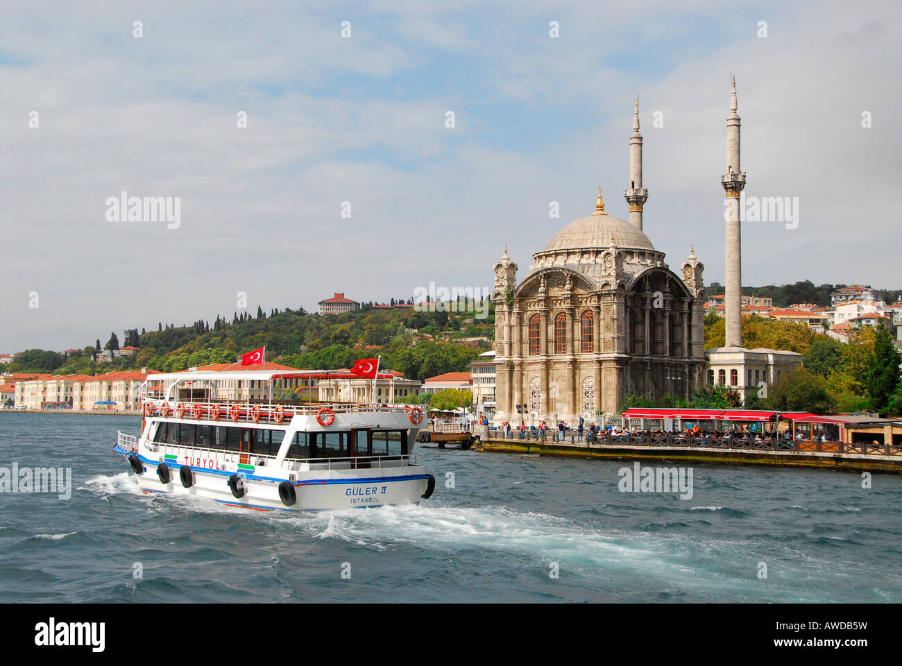 Ferry in front of Ortakoey Camii (Ortakoey mosque) at the Bosporus, Istanbul, Turkey Stock Photo