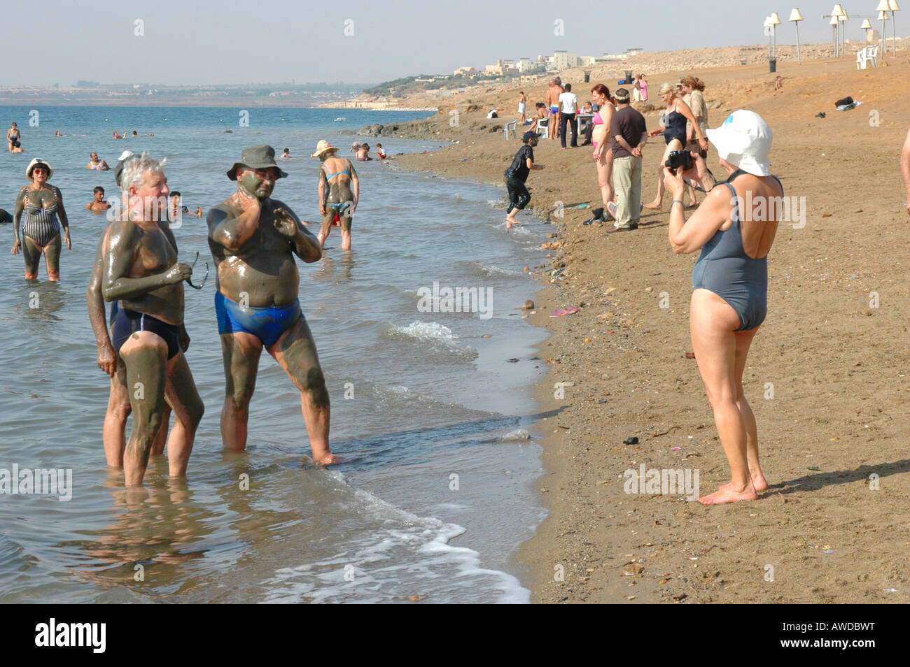 Tourists at a beach at the Dead Sea, Jordan Stock Photo