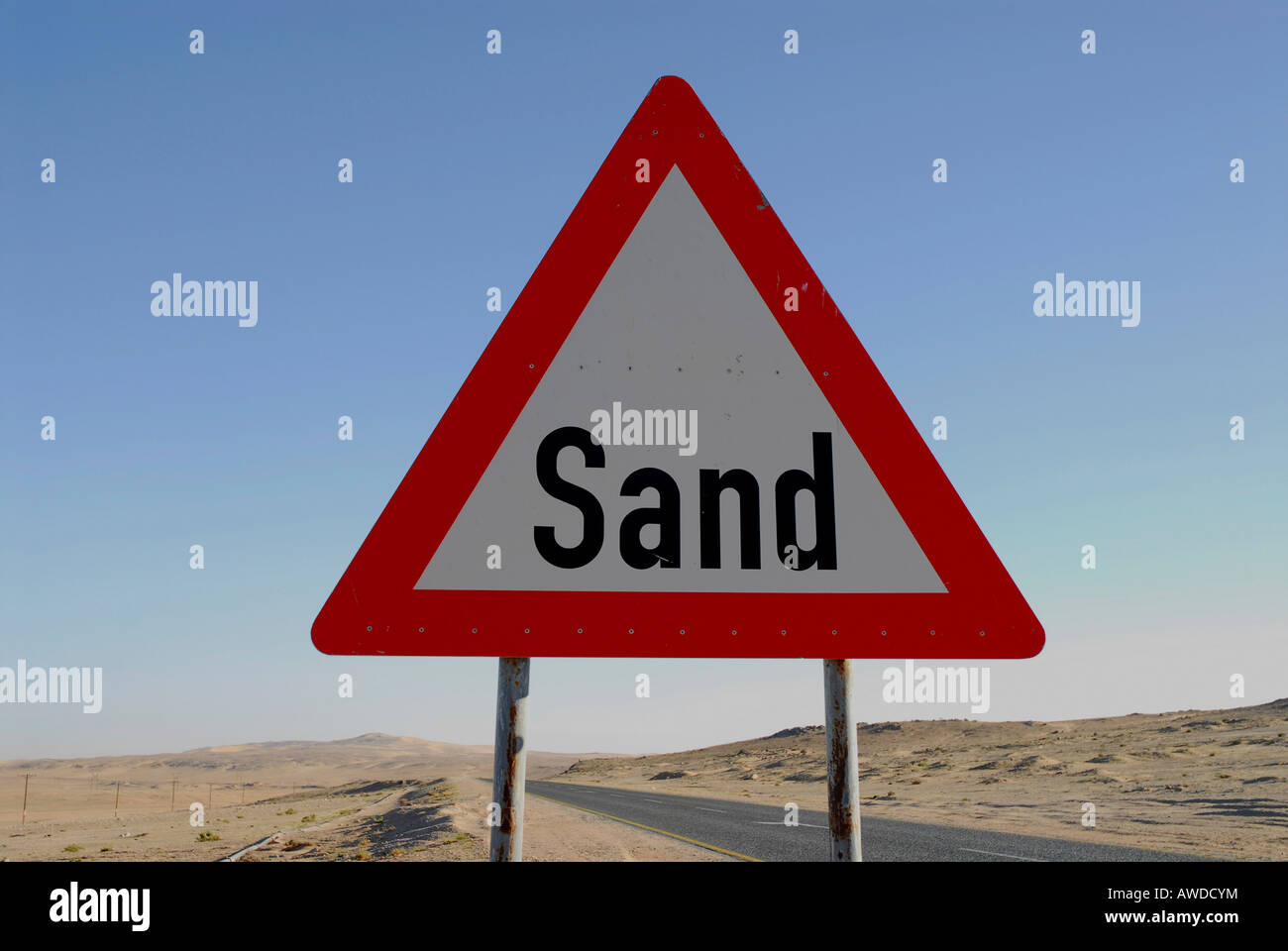 Sand Sign Signals Road sign warning of sweeping sands on a highway near Luederitz ...