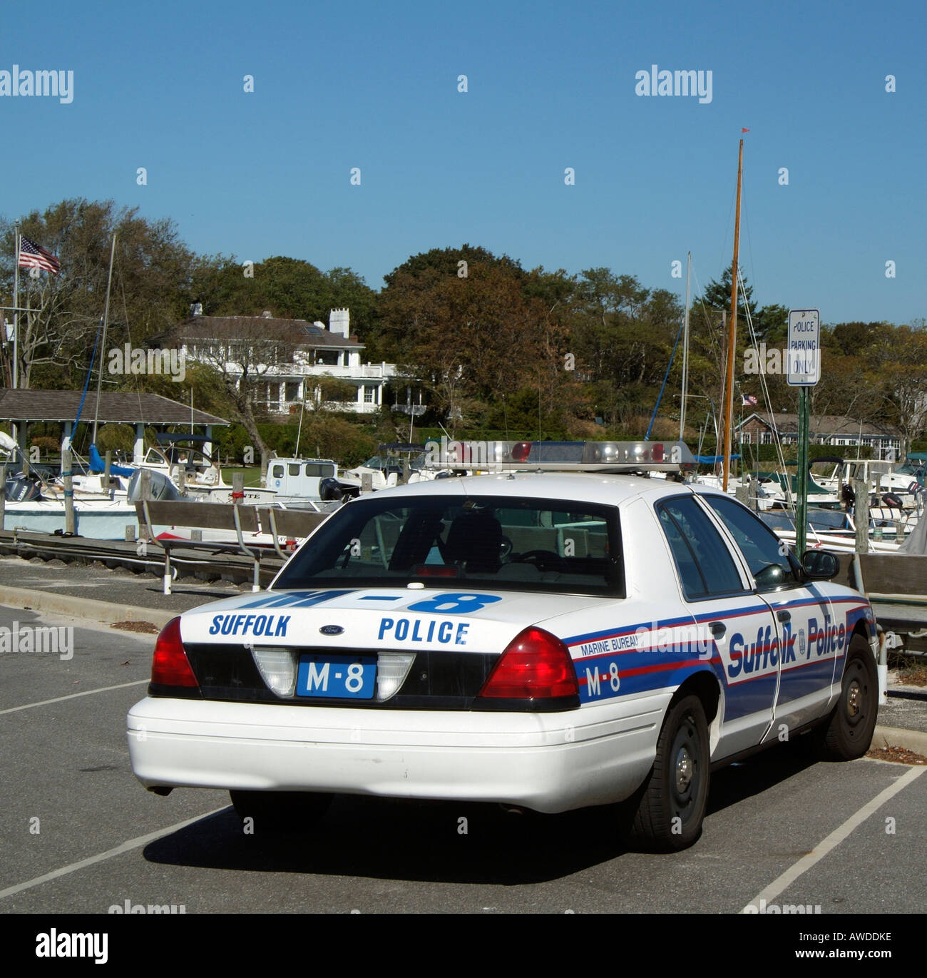 Suffolk County Marine Bureau Police car on Bellport marina Long Island New York USA Stock Photo