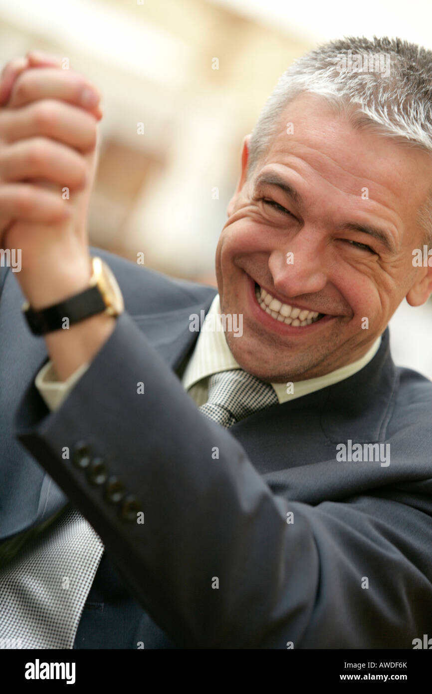 Excited man touching shoulders hi-res stock photography and images - Alamy