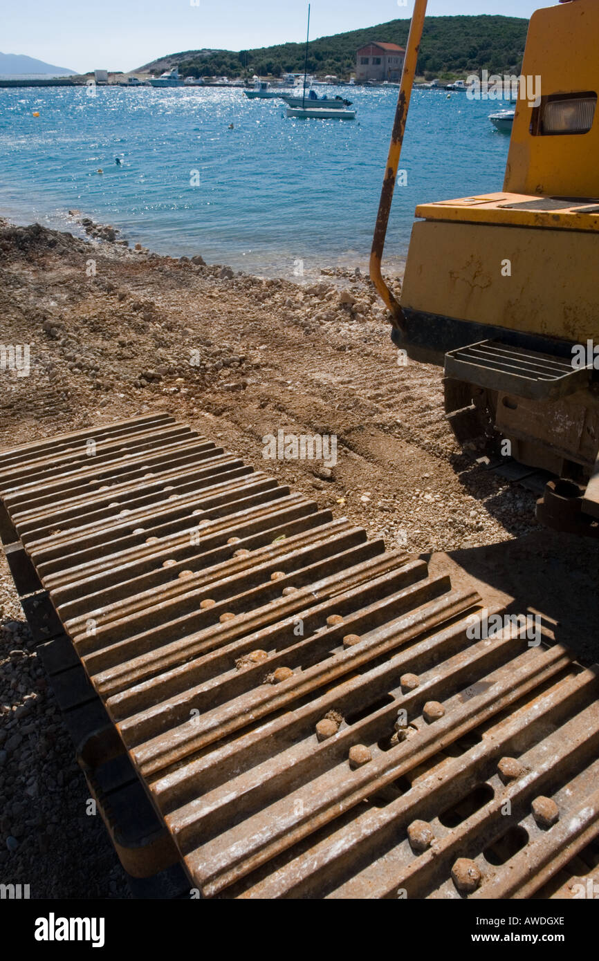 Track detail, working on sea shore Stock Photo