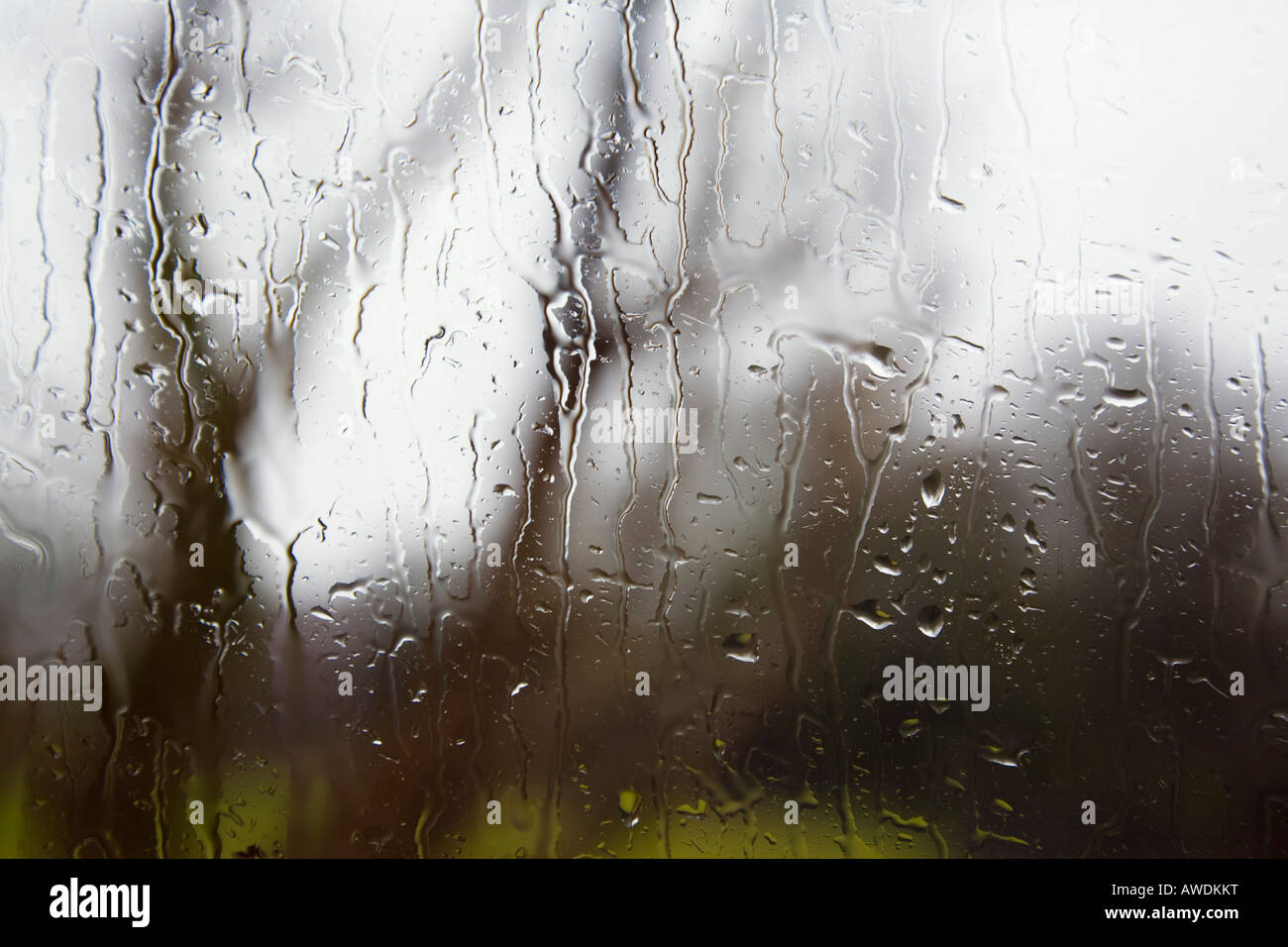 UK Britain February View through window with rain drops of water on ...