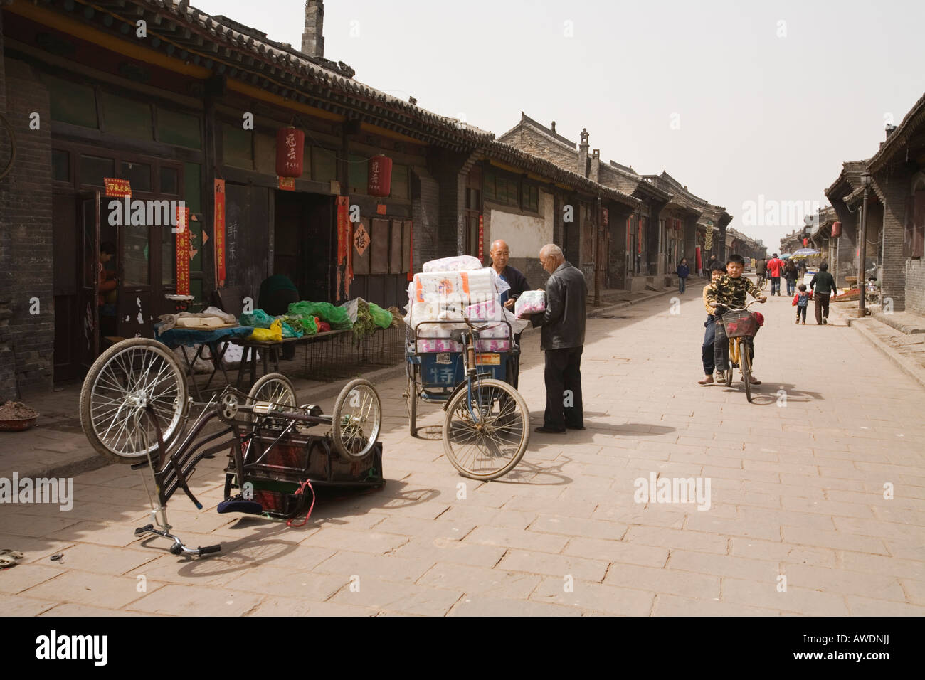 Transporting goods on a street in Pingyao, People's Republic of China Stock Photo