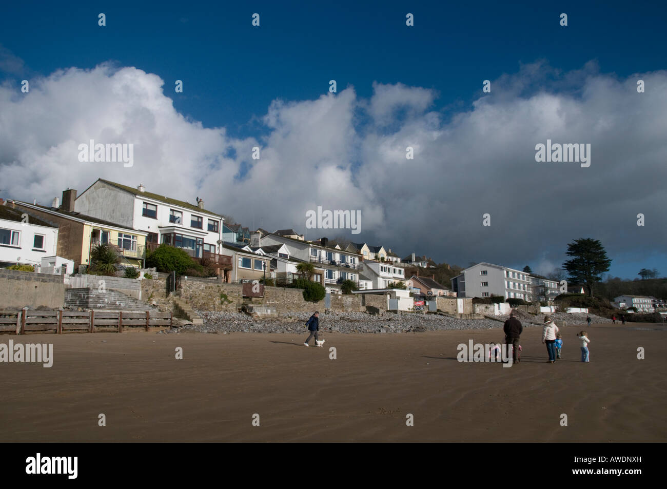 Family walking on the beach at Saundersfoot Pembrokeshire wales flats