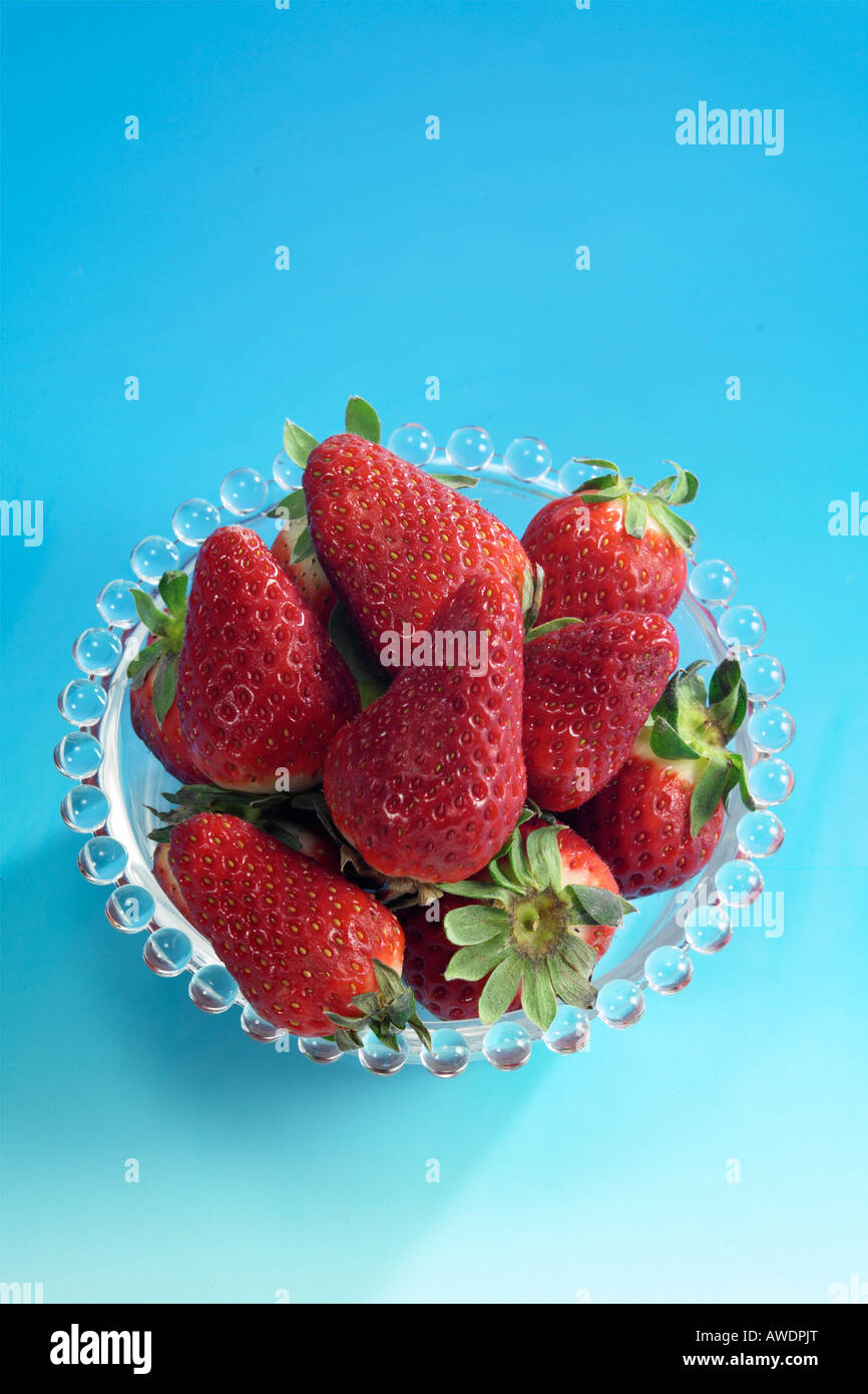 strawberries isolated on blue background Stock Photo - Alamy