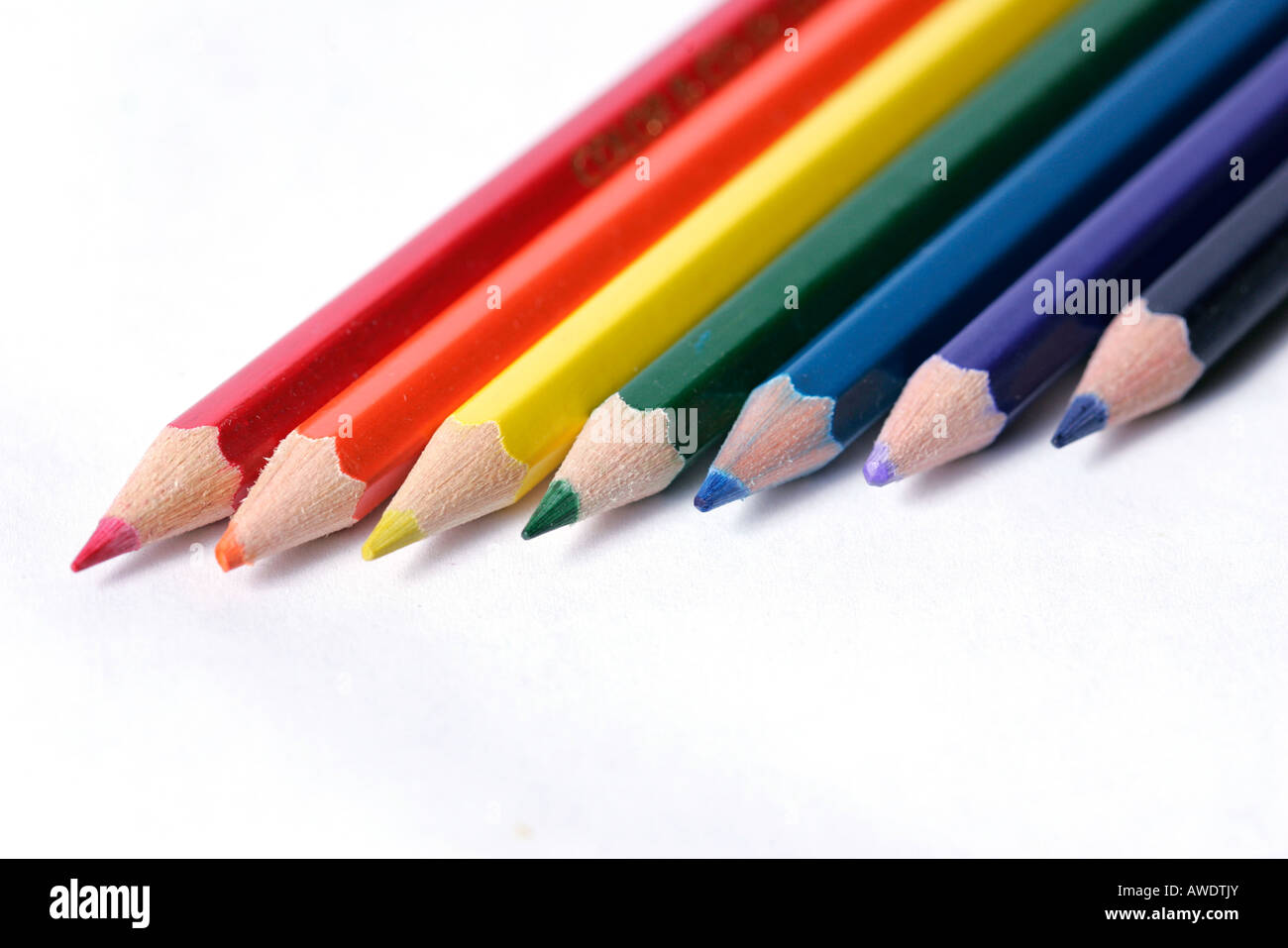 Seven pencil crayons arranged in a row Stock Photo Alamy