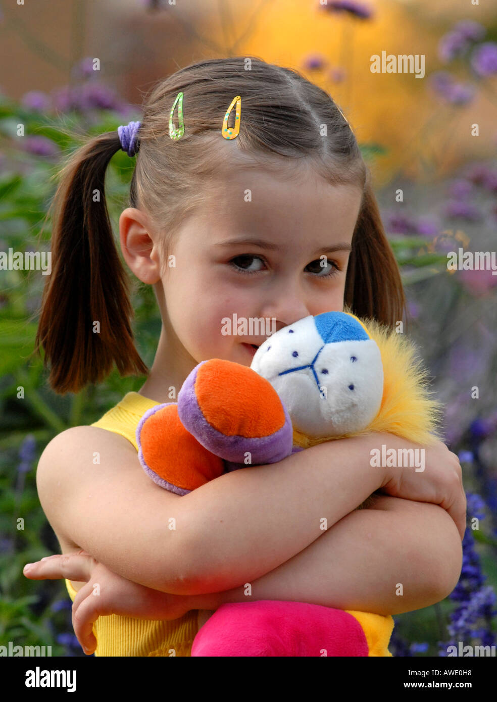 Little girl with stuffed animal Stock Photo - Alamy