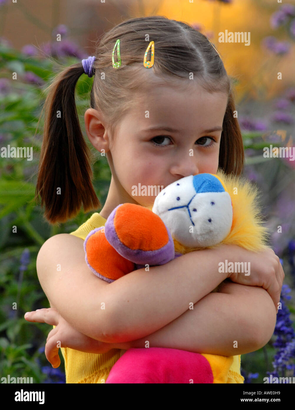 Little girl with stuffed animal Stock Photo - Alamy