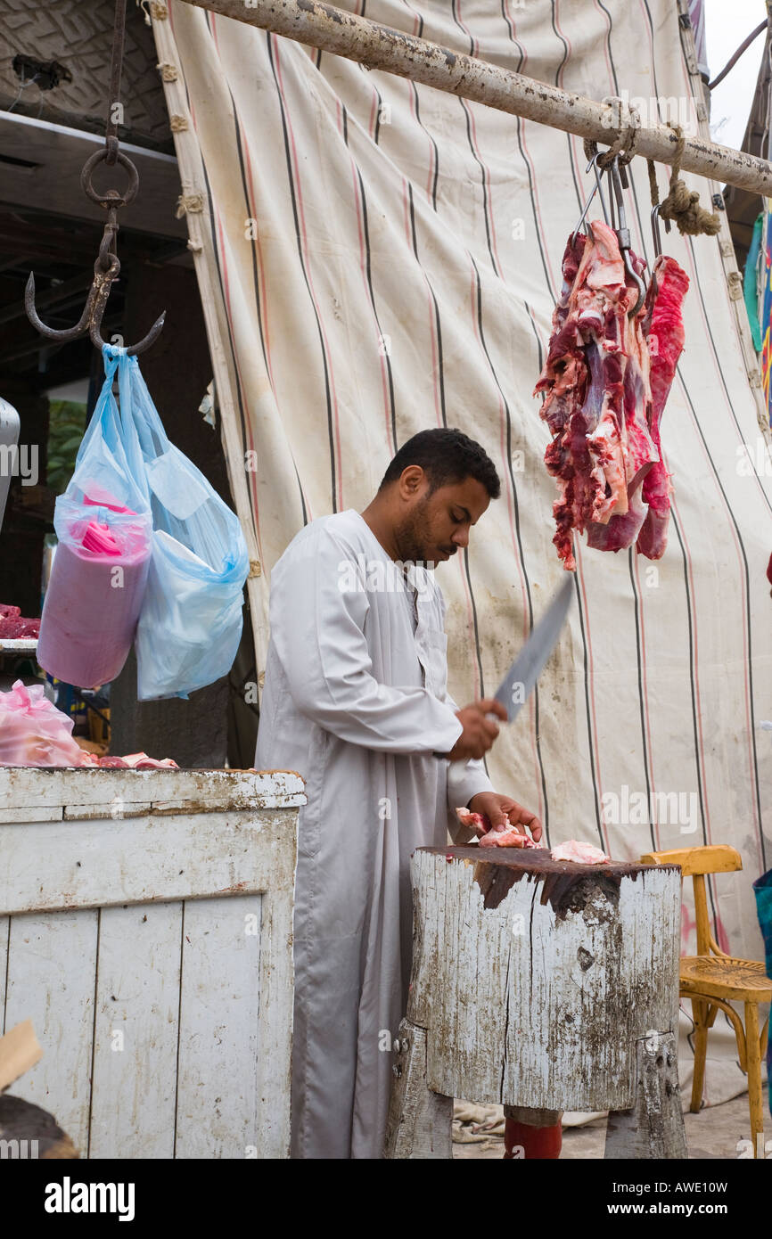 Egyptian butcher at work cutting meat in Old Sharm Sinai, Egypt Stock Photo